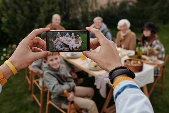 Photo by Askar Abayev: https://www.pexels.com/photo/unrecognizable-person-taking-photo-of-family-dinner-on-smartphone-5638701/