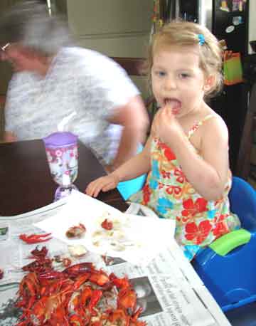 Photo of Zoe eating crawfish.